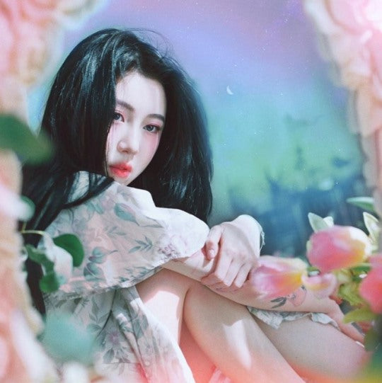 The 'Our Love Is Great' mini album by Baek Yerin, a beautiful collection of soulful music and striking album art.